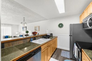 Fridge, microwave, oven, stovetop - Casa Bella Homes-top floor condo unit, centrally located, home away from home (Federal Way)