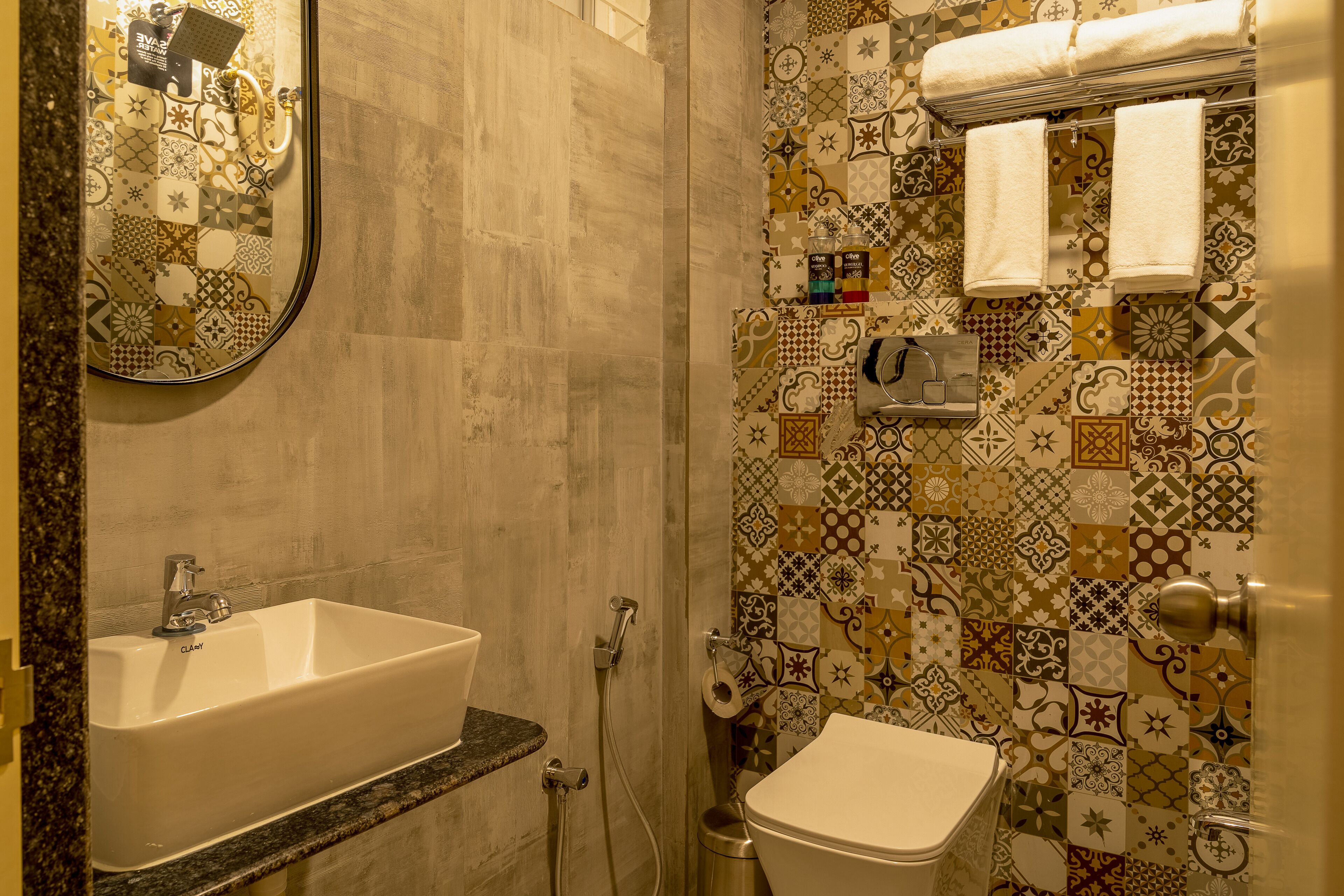 A bathroom with a sink, toilet, and shower.
