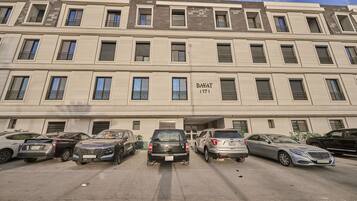 A multi-story building with a sign reading "BAYAT 117".