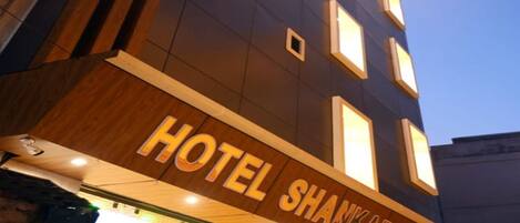 A hotel sign with the name "HOTEL SHANKARA RESIDENCY".