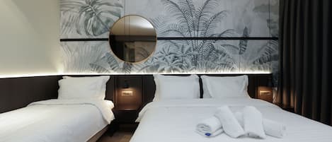 Habitación triple Deluxe | Sistema de insonorización, wifi gratis, ropa de cama