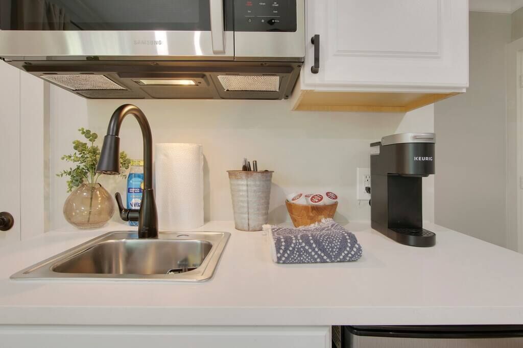 Fridge, microwave, coffee/tea maker, cookware/dishes/utensils