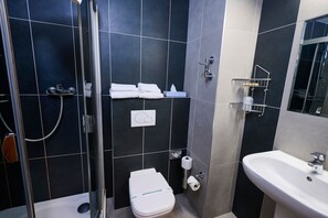 Shower, hair dryer, slippers, towels