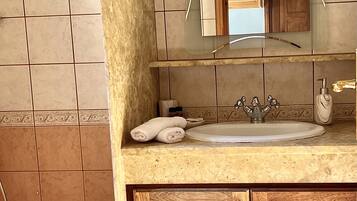 Apartment, Sea View, Ground Floor | Bathroom | Shower, hair dryer, towels