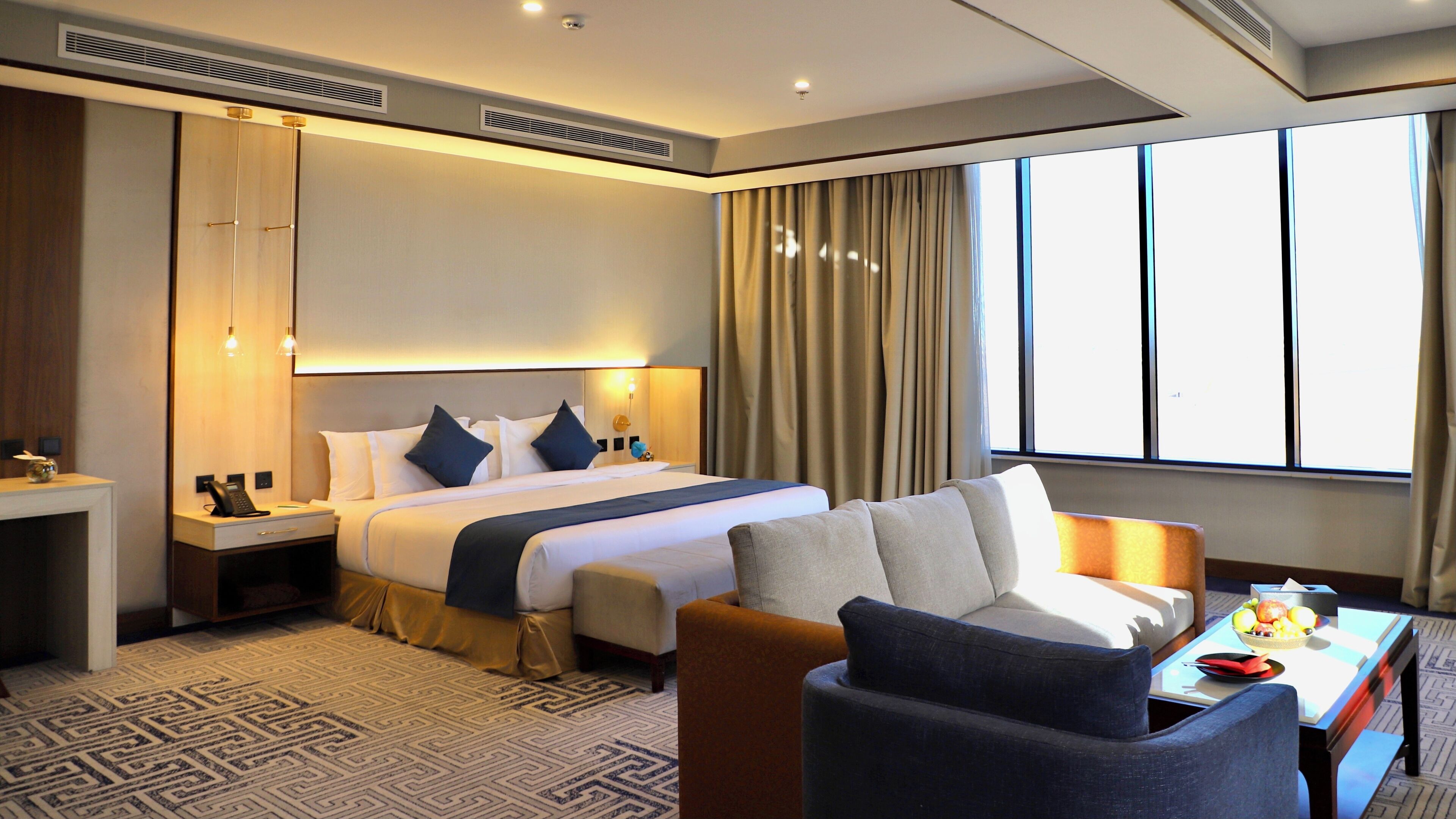 Panoramic Suite, 1 King Bed, City View, Poolside | Egyptian cotton sheets, premium bedding, pillow-top beds, minibar