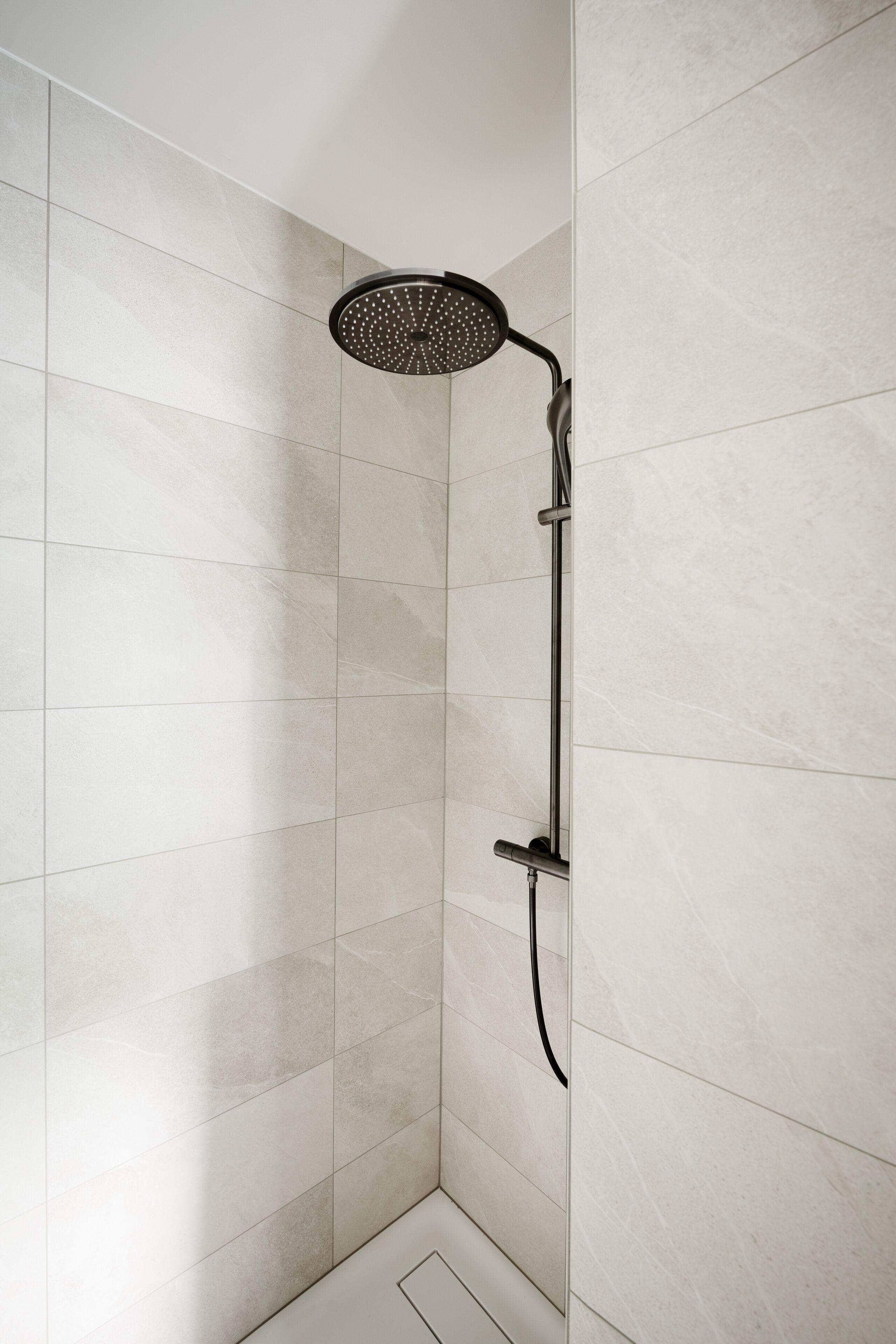 Shower, rainfall showerhead, hair dryer, towels