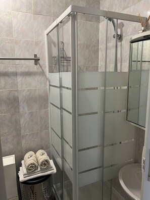 Shower, hair dryer, towels, soap