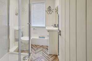 Shower, hair dryer, towels, shampoo