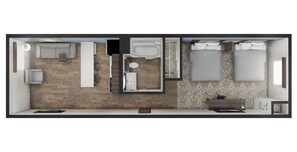 A modern hotel room with a wooden floor, a large bed, a separate bathroom, a small seating area, and a desk. - stayAPT Suites Ocala (Ocala)