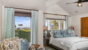 A bedroom with a bed, a sofa, and a view of a grassy area. - Avila with a view! sleeps 5 (Avila Beach)