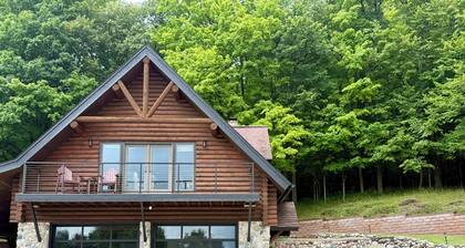 Private Cabin with Lake Views Near Torch Lake, Fire Pit & Boat Parking