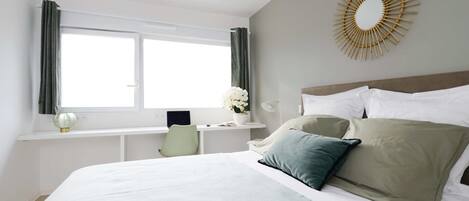 Premium bedding, individually furnished, laptop workspace