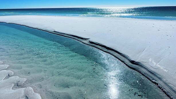 A beach with clear turquoise water and white sand, under a bright blue sky. - Gorgeous new beach cottage in fantastic location! (Destin)