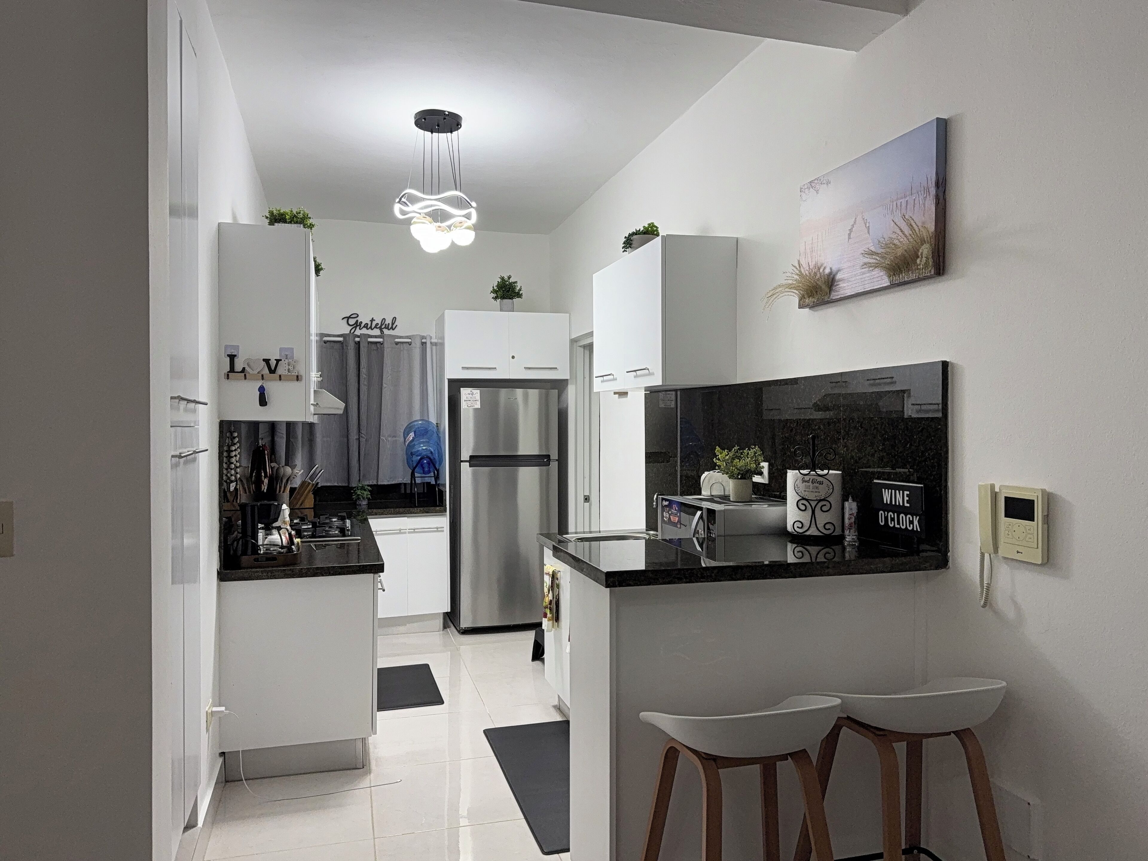 Fridge, microwave, stovetop, coffee/tea maker