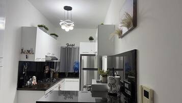 Fridge, microwave, stovetop, coffee/tea maker