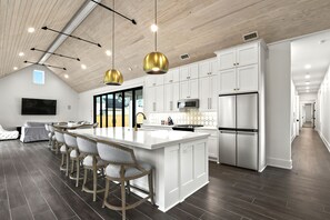 Fridge, microwave, oven, stovetop - The Luxe on Main is an Ultra-Modern, Trendy New Construction in Downtown BSL. (Bay St. Louis)