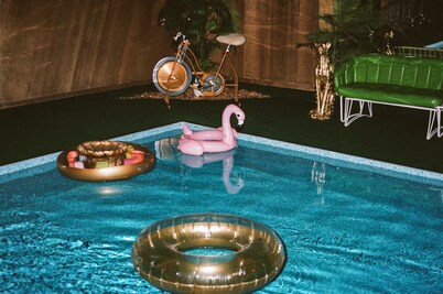 Vintage kitsch 70s/80s themed house with indoor pool and backyard creek