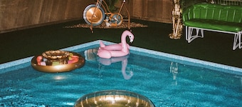 Vintage kitsch 70s/80s themed house with indoor pool and backyard creek
