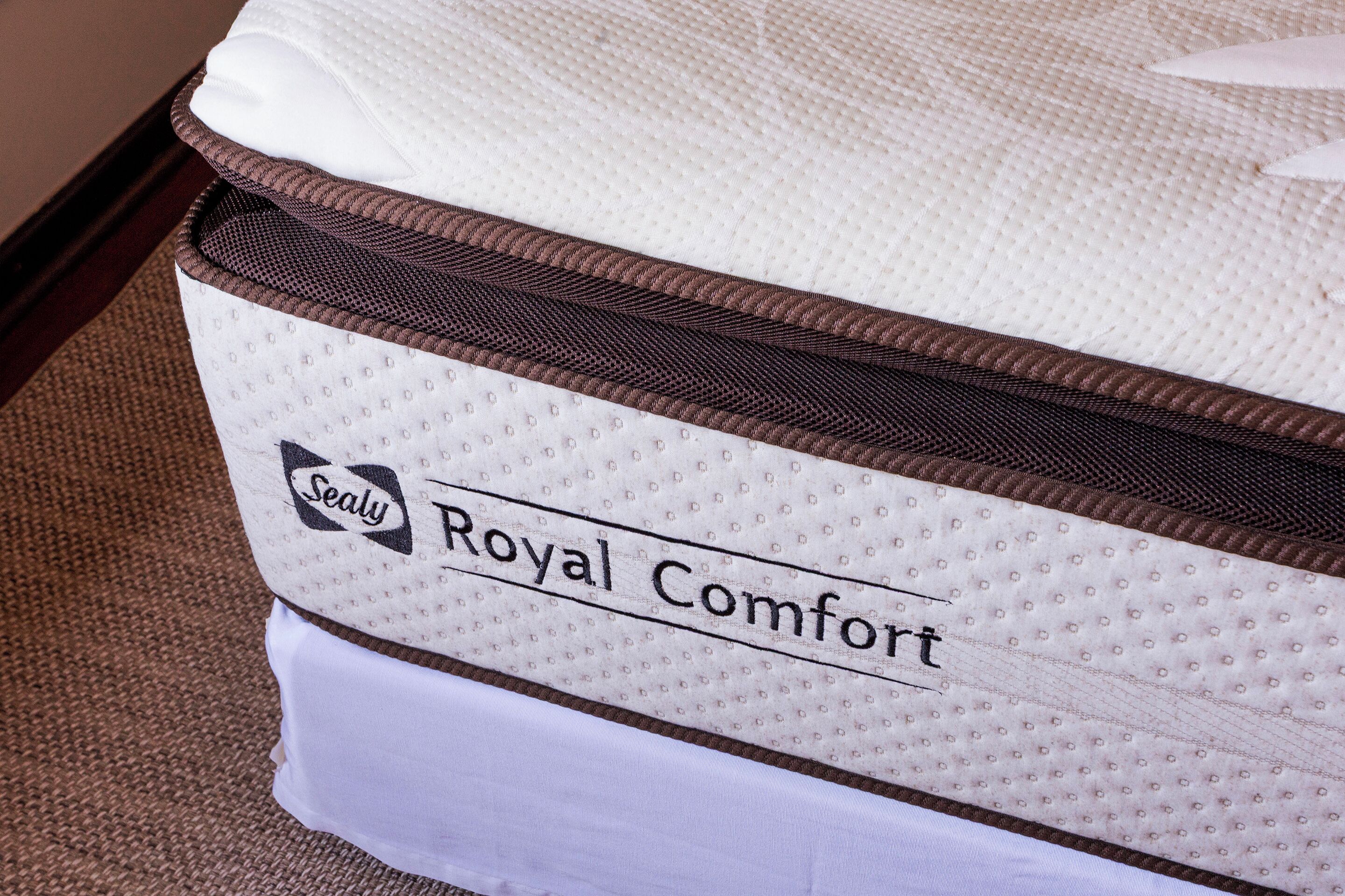 A mattress labeled "Royal Comfort" with a "Sealy" logo.