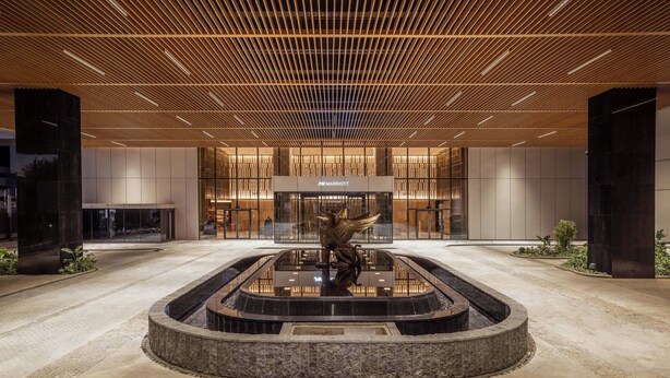 A modern hotel lobby with a central water feature and a sign reading "JW MARRIOTT". - JW Marriott Hotel Nairobi (Nairobi)