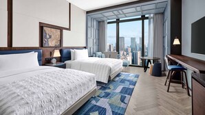 A hotel room with two beds, a desk, a chair, a TV, and a large window with a city view. - Le Méridien Shenzhen, Bao'An (Shenzhen)