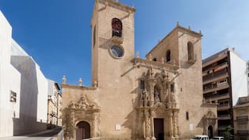 A historic building with a prominent clock tower and ornate architectural details.