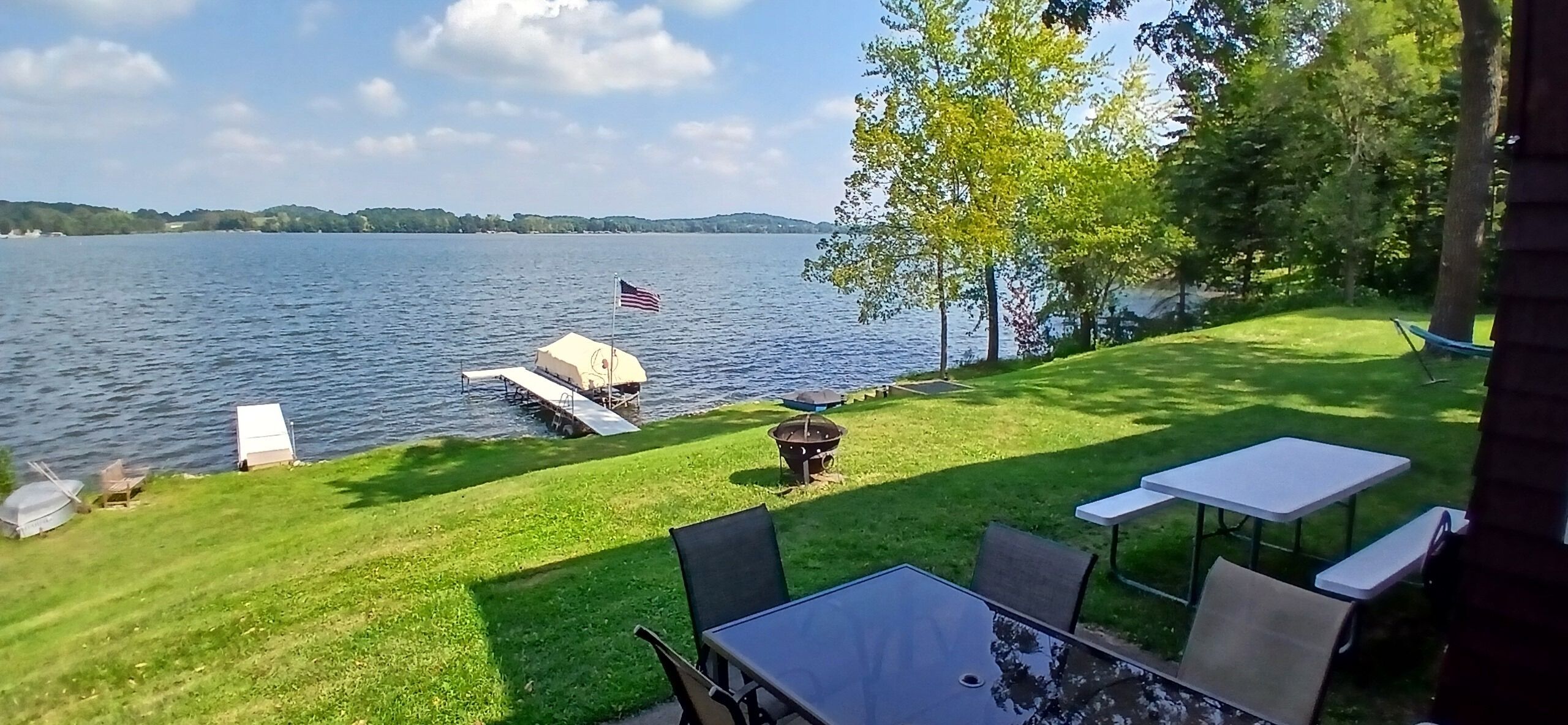 Patio/lakeside area with guest dock