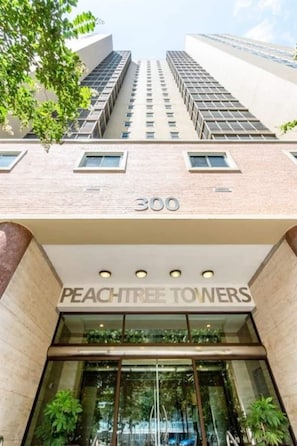 Welcome to Peachtree Tours, a building with a glass facade offering a clear view into the lobby.