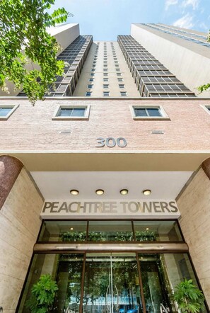 A building with the address '300' and the name 'PEACHTREE TOYERS' on the facade.