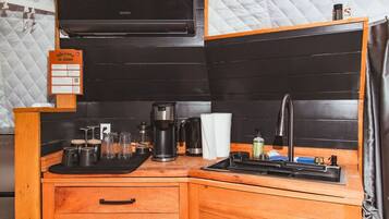 Microwave, stovetop, coffee/tea maker, cookware/dishes/utensils