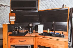 Microwave, stovetop, coffee/tea maker, cookware/dishes/utensils