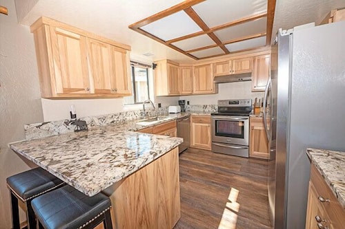 Waterfront Home with Mountain Inspired Decor, Private Hot Tub and Boat Dock 2085S~