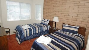 A room with two beds, a desk, and a window with blinds. - Waterfront Condo - Easy Lake Access, Private Boat Dock (South Lake Tahoe)
