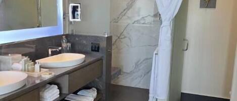 Shower, hair dryer, towels, soap