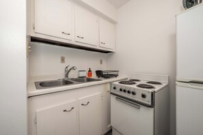 Hus, flere senger, kjøkken, hageutsikt (Northside Suites) | Eget kjøkken | Kjøleskap, mikrobølgeovn, ovn og kokeplater