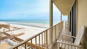 A balcony with a view of the beach and ocean. - Oceanfront Oasis Beachfront Condo w/ Views! (Gulf Shores)