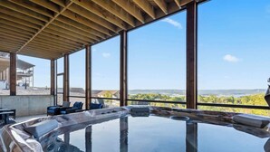 A hot tub with a clear view of the surrounding landscape.