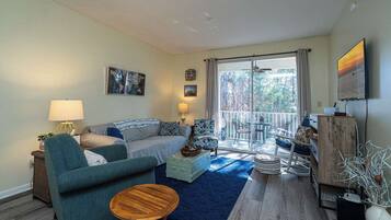 Condo, Multiple Beds, Balcony, Garden View (Fun Times) | Living area | 42-inch flat-screen TV with digital channels
