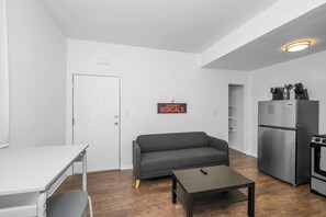 Apartment, 1 Queen Bed, Kitchen, Garden View | Living area | TV