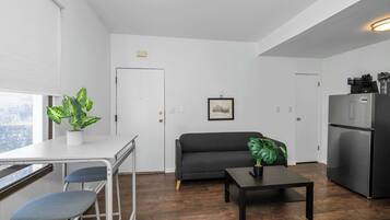 Apartment, 1 Queen Bed, Patio, Garden View | Living area | 42-inch flat-screen TV with digital channels