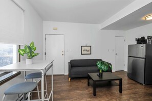 Apartment, 1 Queen Bed, Patio, Garden View | Living area | 42-inch flat-screen TV with digital channels