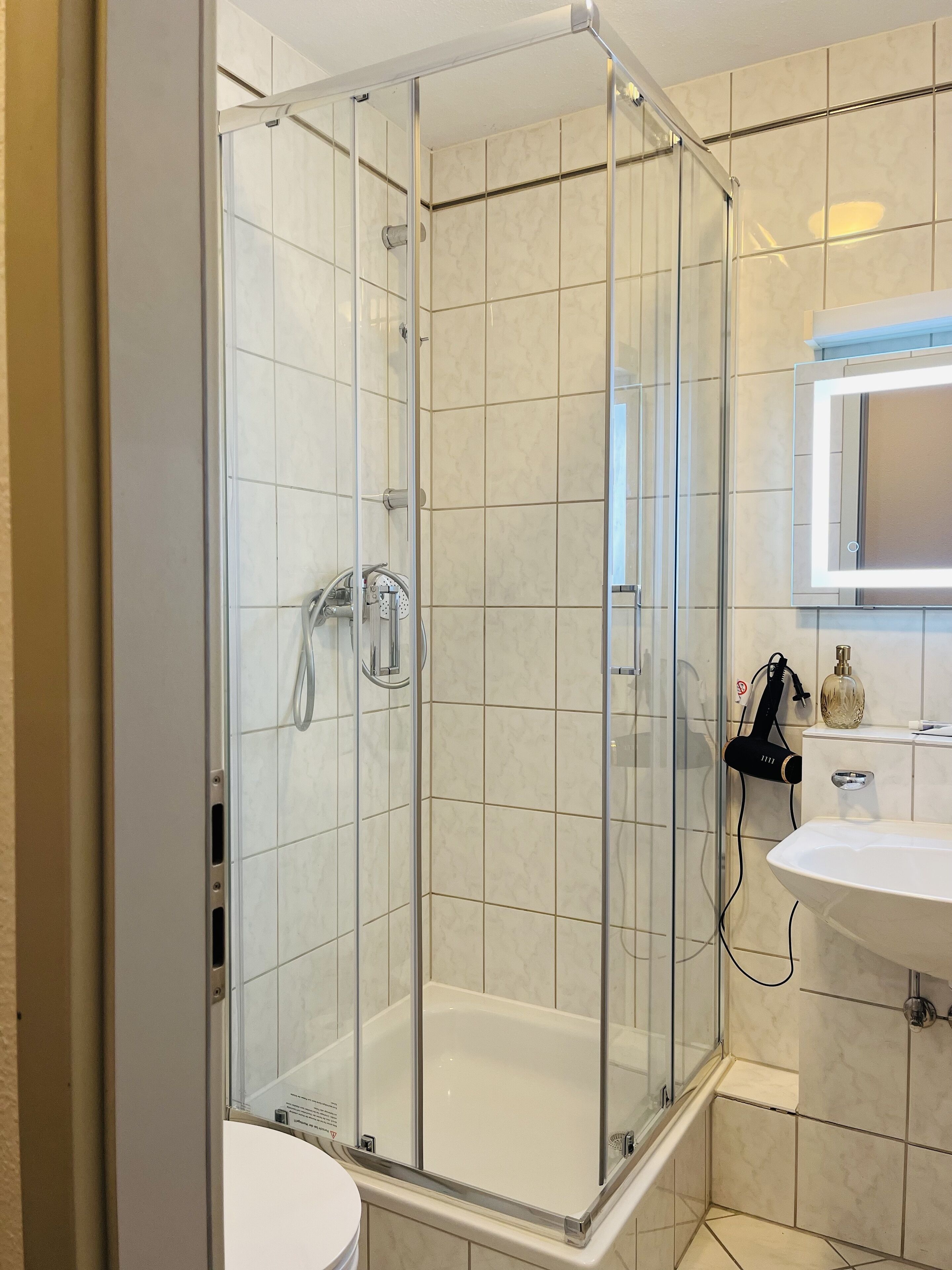 Hair dryer, towels, soap, shampoo