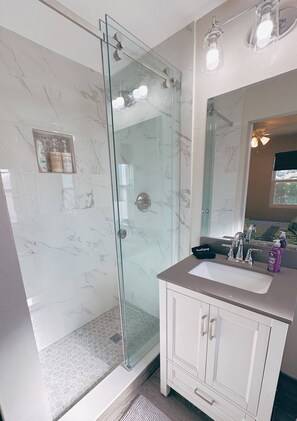 Shower, hair dryer, towels, soap
