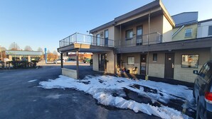 A two-story building with a covered entrance and a balcony. - DuBois Manor Motel  (DuBois)