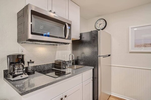 Fridge, microwave, stovetop, coffee/tea maker