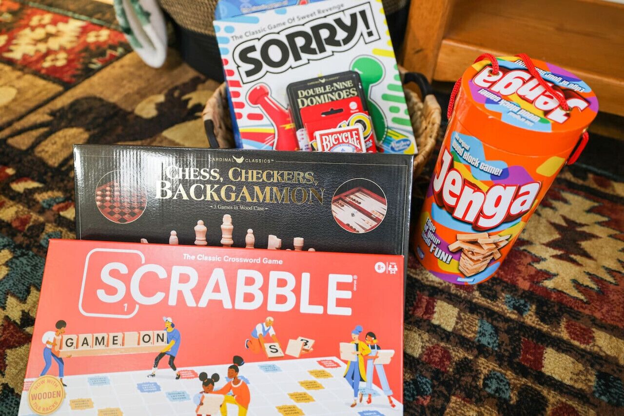 A variety of board games including Scrabble, Sorry!, and Jenga.