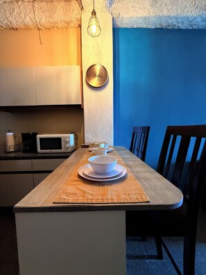 Fridge, microwave, stovetop, coffee/tea maker