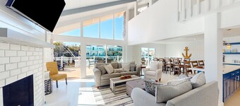 Waterfront home with kayaks, grill, Pac-Man, AC, balconies, & smart TVs