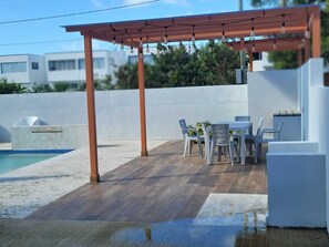 Outdoor dining - Poolside Paradise: 2BR Downtown! (Punta Cana)