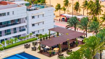 Outdoor pool, a heated pool, free cabanas, pool umbrellas